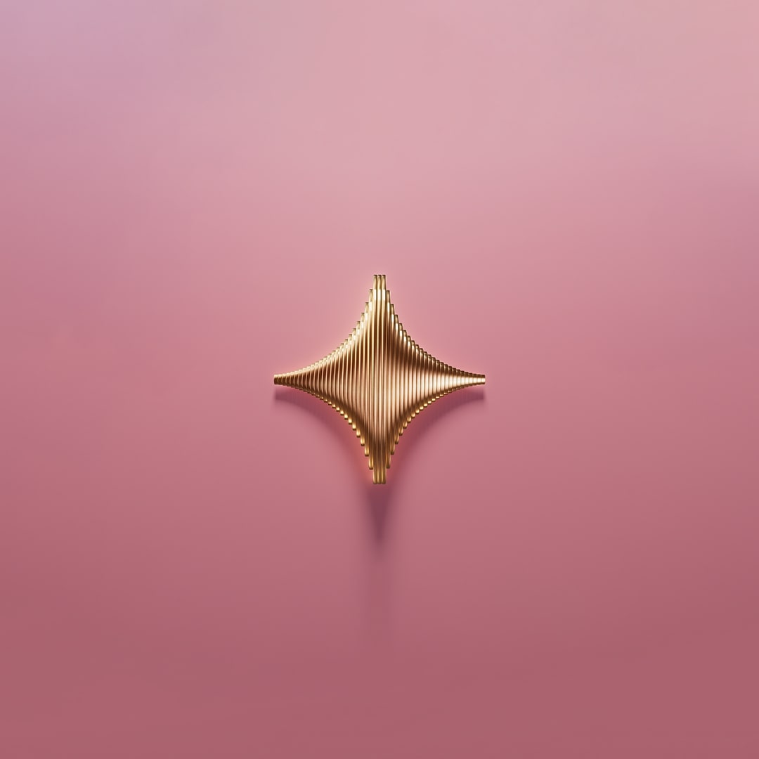 Metal star on pink background